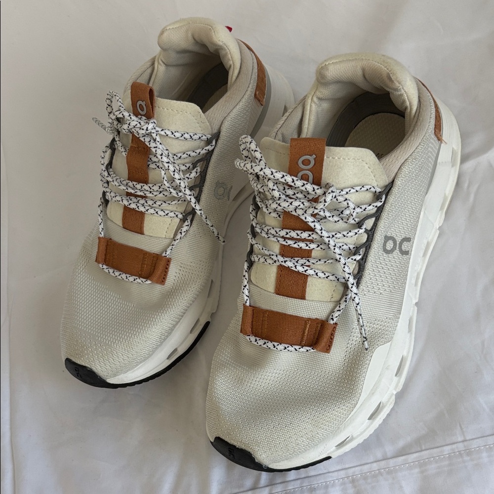 On Running Cream and Brown Sneakers